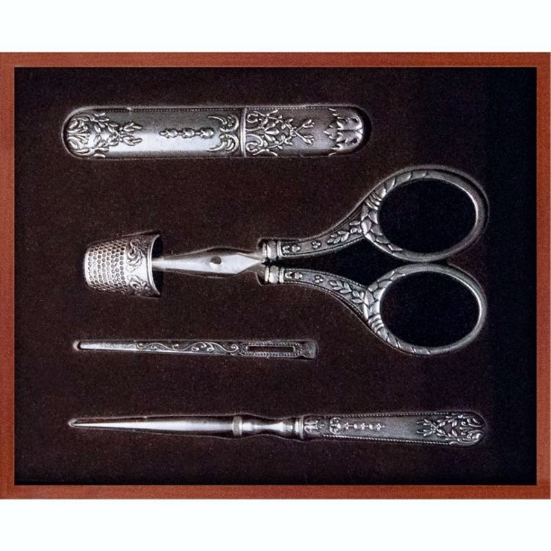 Includes 3 1/2" needle case, 3/4" thimble, 4" embroidery scissors, 2 3/4" bodkin and 4 3/4" awl.