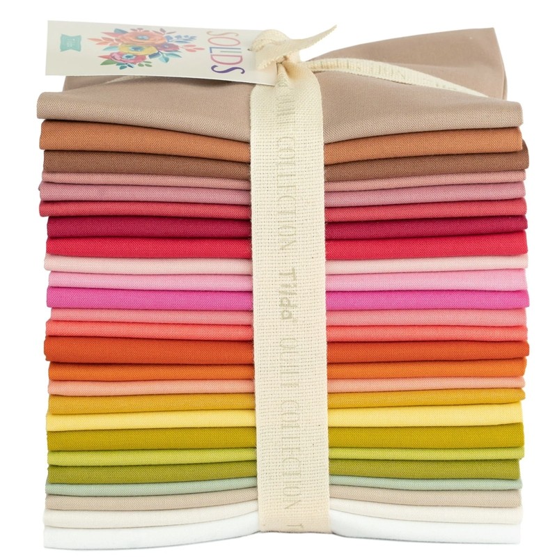 Tilda® Basics Solid Warm Fabrics Fat Quarter Bundle includes 25 colors.